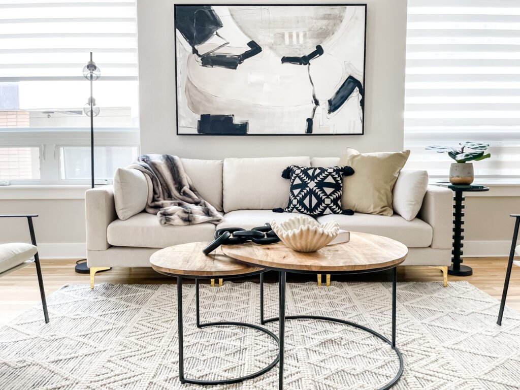 Luxury staged living room in Denver with modern furniture and sleek wooden tables